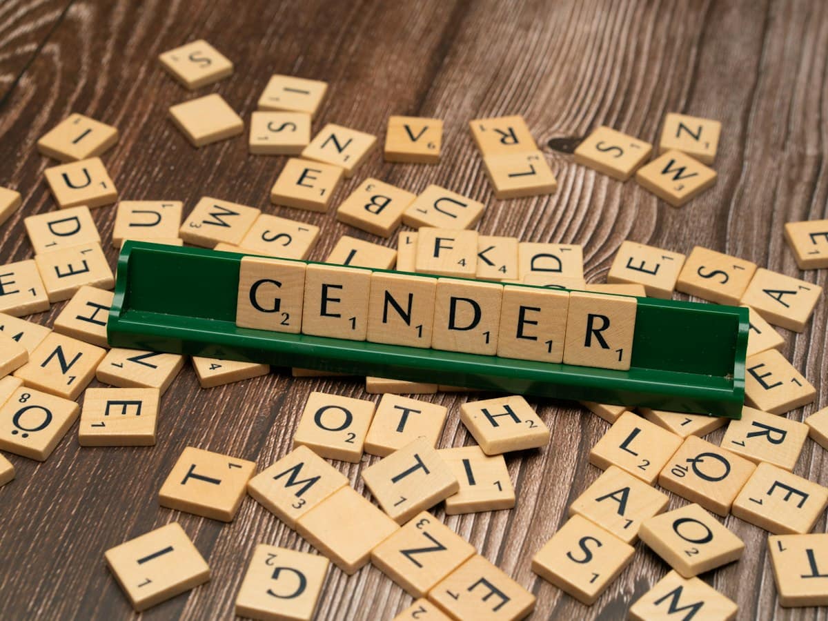 Letter tiles spelling the word gender